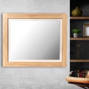 A sleek bedroom mirror with Oak White frame