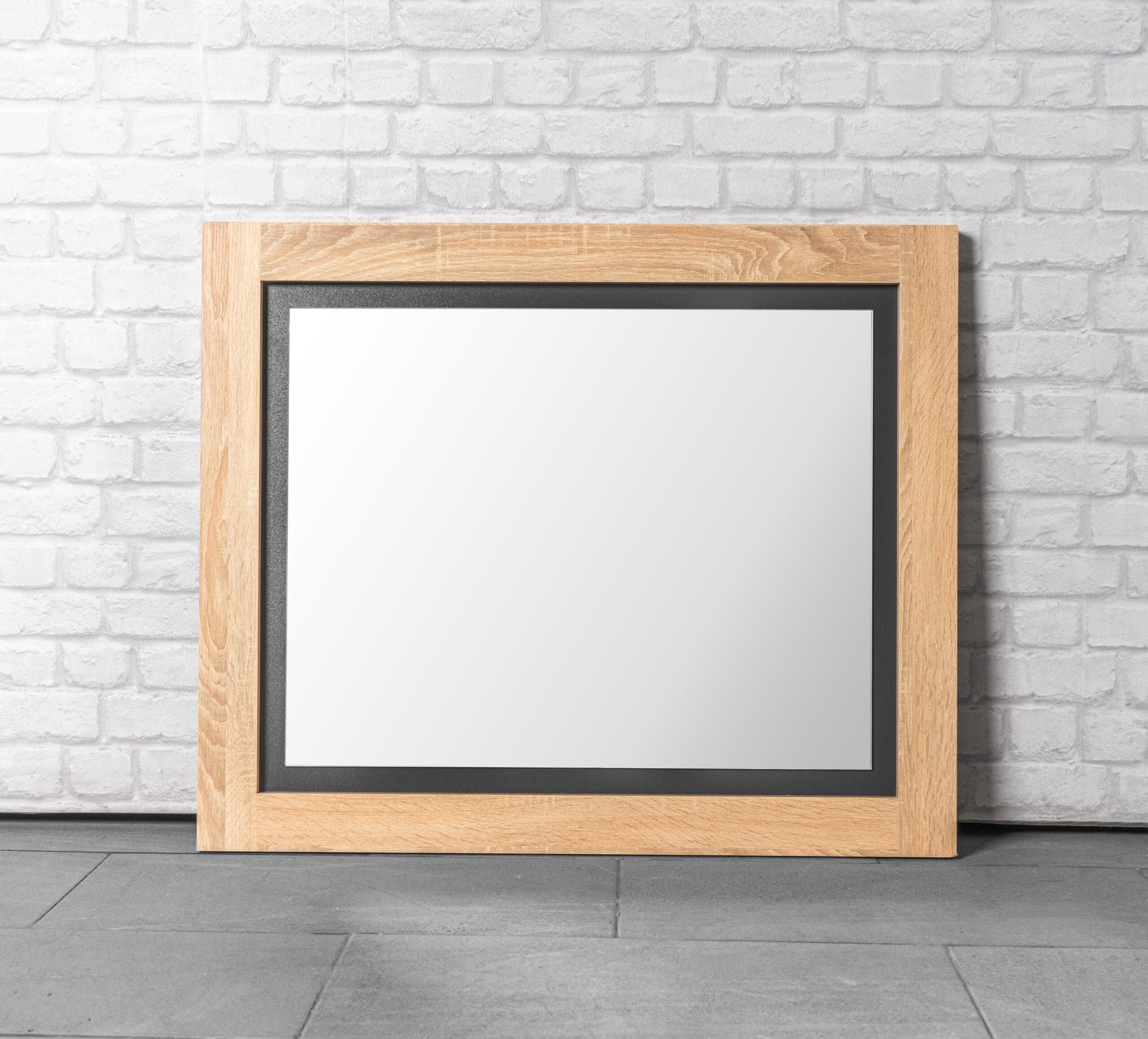 Close-up of a stunning wooden mirror with Oak Grey finish