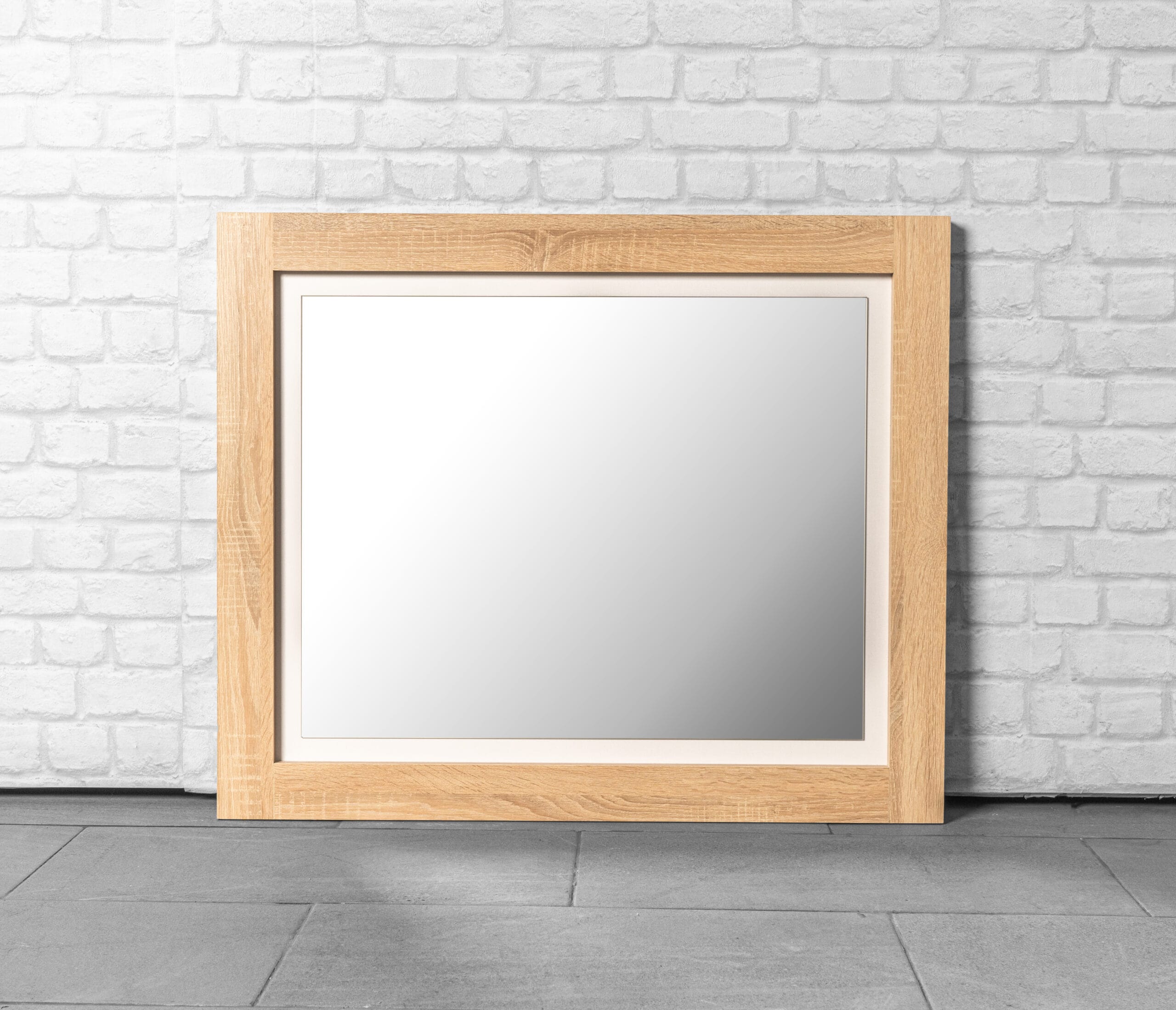 Close-up of a chic wooden mirror with Oak White finish