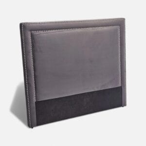 Close-up of velvet upholstery on bed headboard