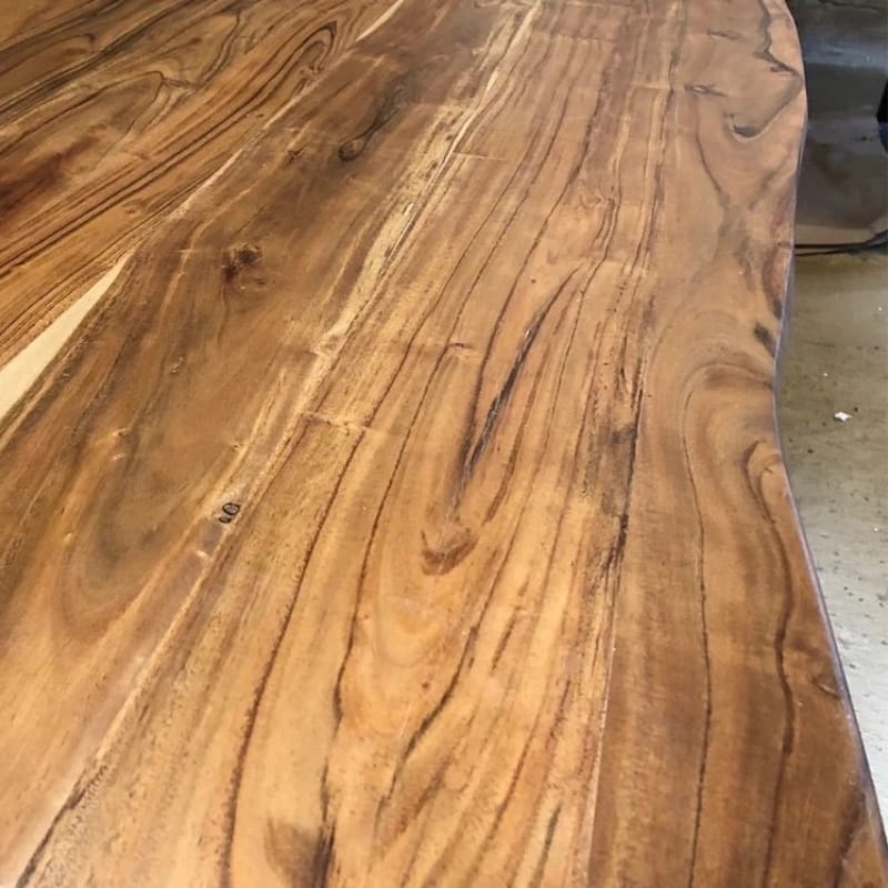 Industrial-style dining table made from solid acacia wood with metal frame